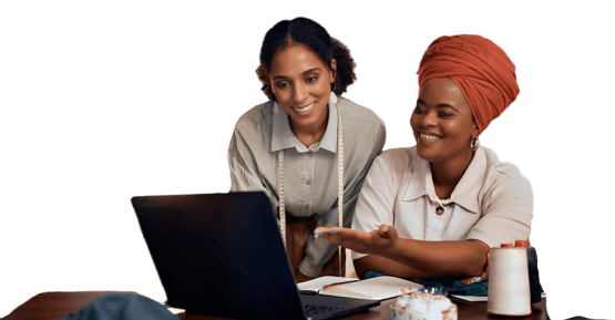 A picture of two African women shopping online on a laptop