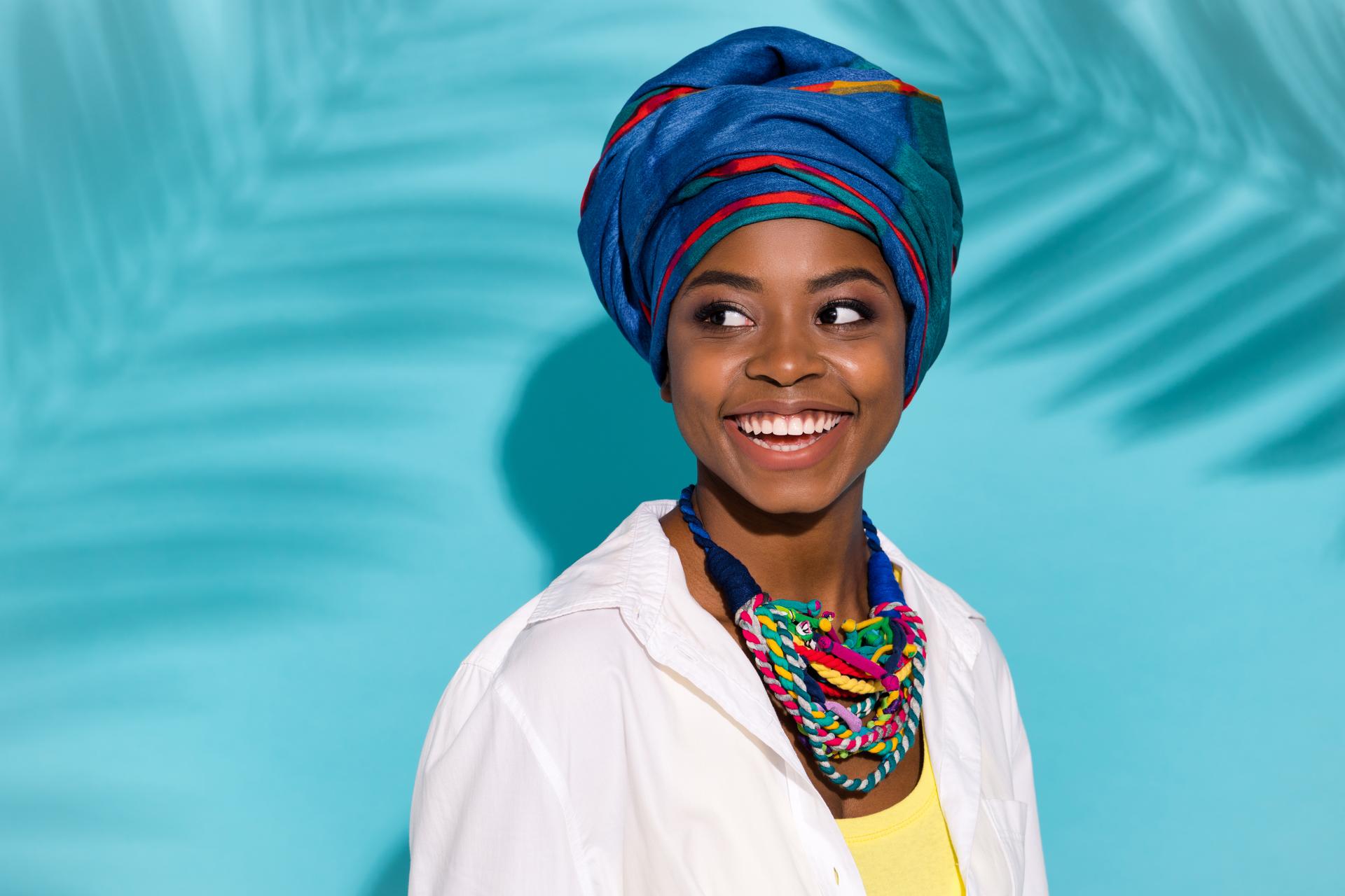 Smiling African woman wearing an african scarf